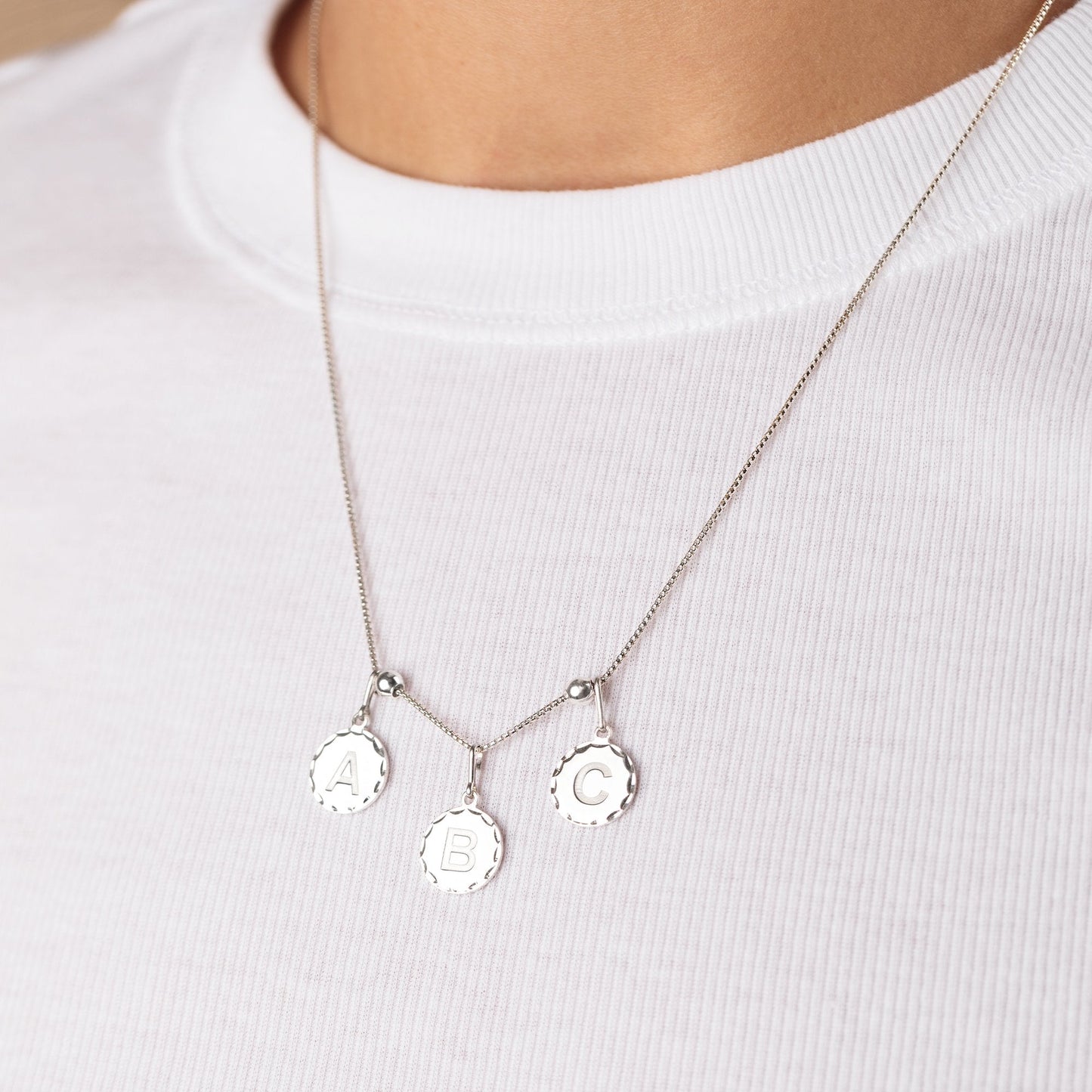 Initial V Charm